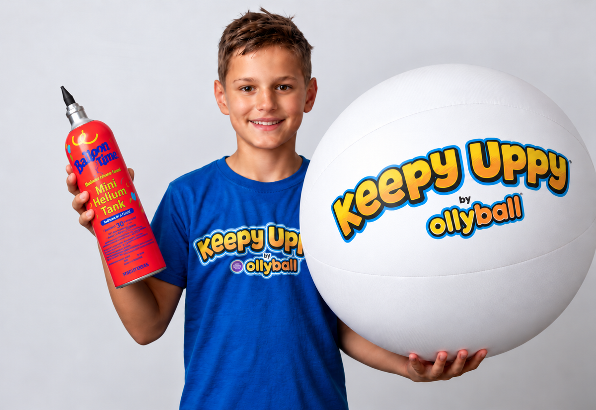 Boy holding the white 22-inch Keepy Uppy® MEGA ball and the included Balloon Time mini helium tank